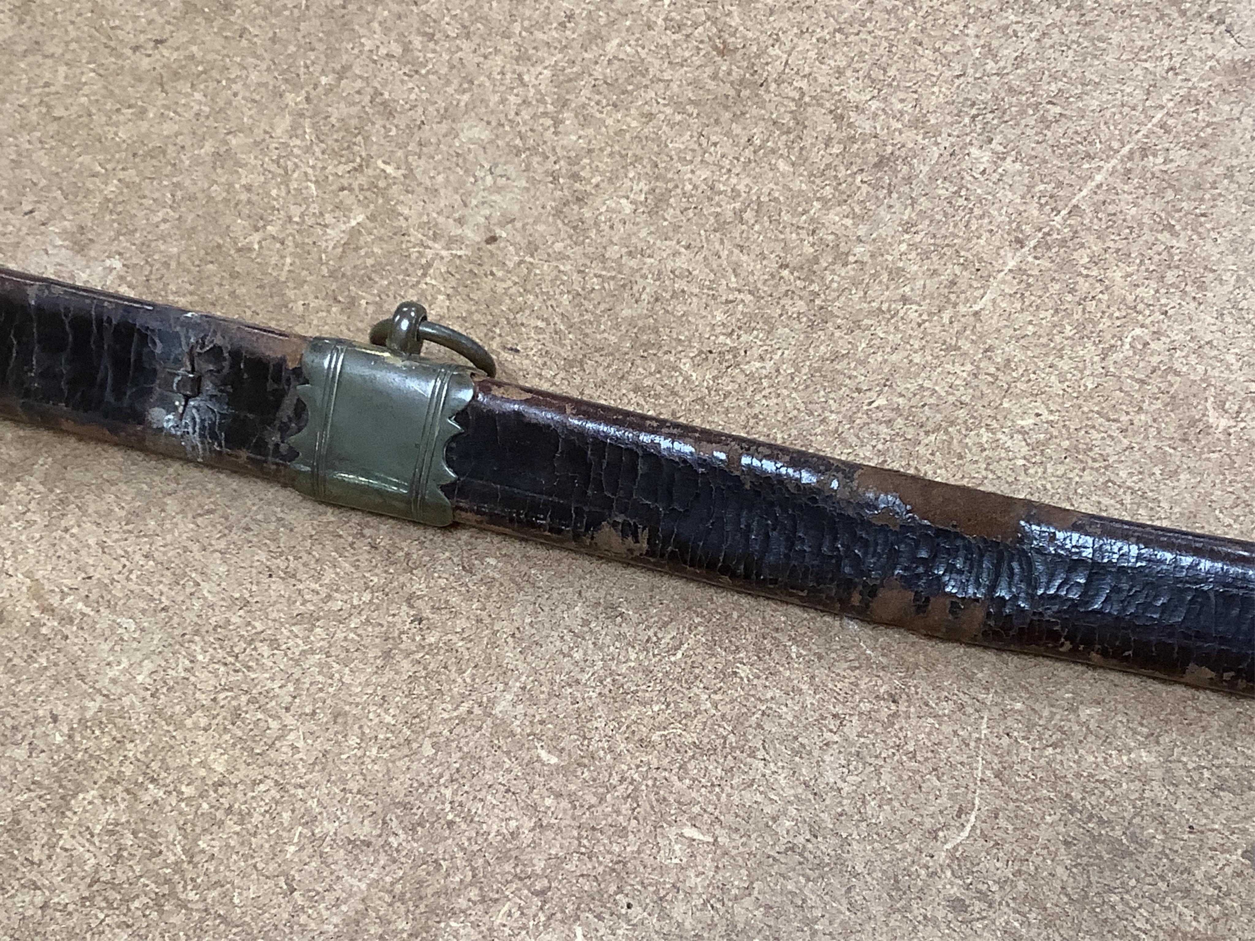 A 1796 pattern infantry officer's sword, blued and gilt blade, etched with crowned GR and Royal Arms, regulation gilt brass hilt, in its leather scabbard with brass mounts, locket signed S. Brunn, 81.5cm. Condition - goo